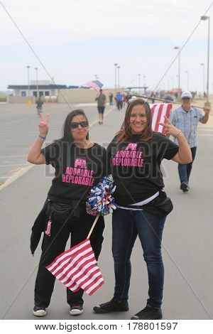 Huntington Beach, CA - March 25 2017: Make America Great Again March. Thousand of Supporters of republican president Donald Trump, wear T-Shirts march and wave flags, at a MAGA March. 




