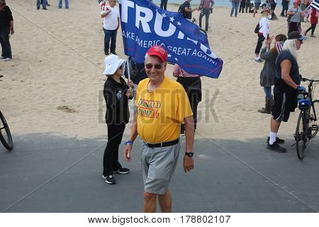 Huntington Beach, CA - March 25 2017: Make America Great Again March. Thousand of Supporters of republican president Donald Trump, march and wave flags, at a MAGA March in Huntington Beach. 




