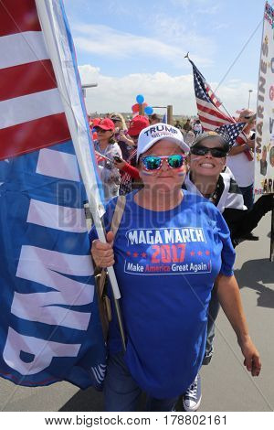 Huntington Beach, CA - March 25 2017: Make America Great Again March. Thousand of Supporters of republican president Donald Trump, march and wave flags, at a MAGA March in Huntington Beach. 




