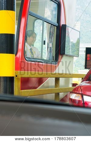 Chongzuo, China - September 16, 2016: Chinese Girl Charging Toll On The Highway