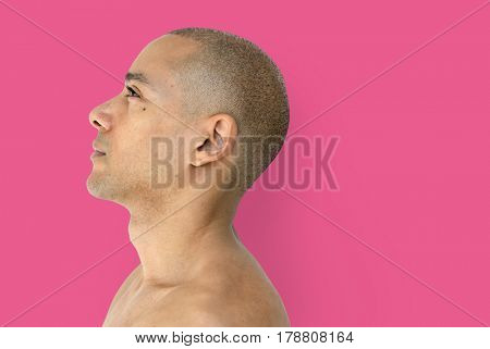 A skinhead guy is in a studio shoot