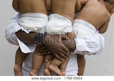 Stessed dad with his hands full isolated on white.