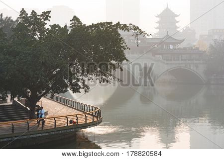 Chengdu Sichuan Province China - Dec 26 2015: Chinese woman training with sword in the morning fog