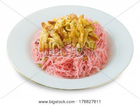 Thai Cuisine and Food A Plate of Red Stir Fried Rice Noodle Served with Julienne Omelet and Chopped Scallion Isolated on White Background.