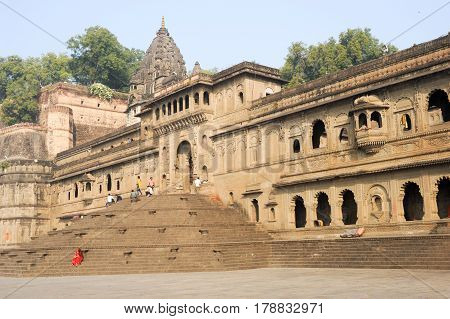 Maheshwar India - 3 February 2015: People walking in front of Maheshwar palace on India