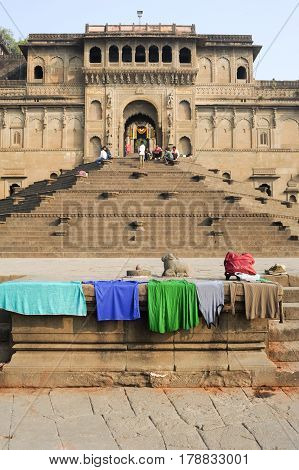 Maheshwar India - 3 February 2015: People walking in front of Maheshwar palace on India