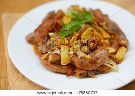 Pork chitterlings, fried garlic, pepper on the plate