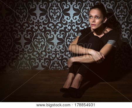 Sad Woman Sinning On A Floor