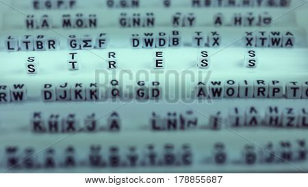 Stress letters between other blurred lettters, black and white.