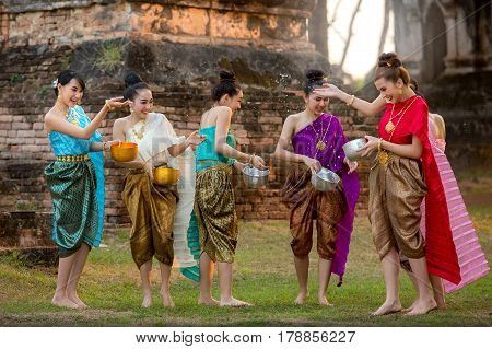 Thai girls and laos girls splashing water during festival Songkran festival