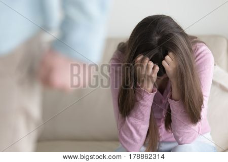 Boyfriend leaving sad girl, woman sitting indoors and crying, man breaks up relationships, frustrated depressed lady after arguing, domestic violence awareness, unhappy couple getting through breakup