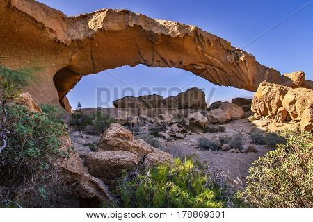 Arco de Tajao is natural arch on the south coast of Tenerife, Canary Islands