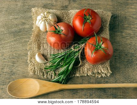 Ingredients for cooking. Concept - Mediterranean diet. Tomatoes greens garlic.
