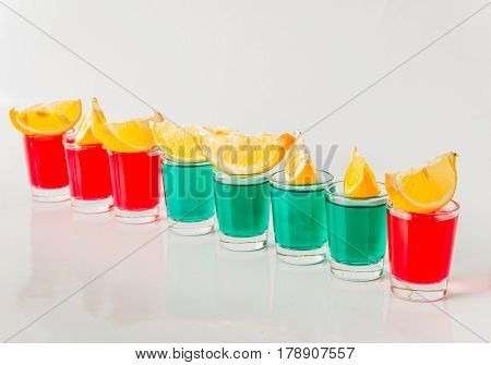 Glasses With Green And Red Kamikaze, Glamorous Drinks, Mixed Drink Poured Into Shot Glasses
