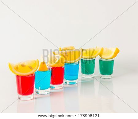 Glasses With Blue, Green And Red Kamikaze, Glamorous Drinks, Mixed Drink Poured Into Shot Glasses