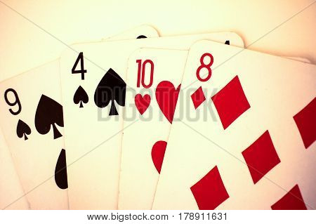 Playing Cards Close Up Detail. Black And Red Cards With A Little Bit Sepia Fiter
