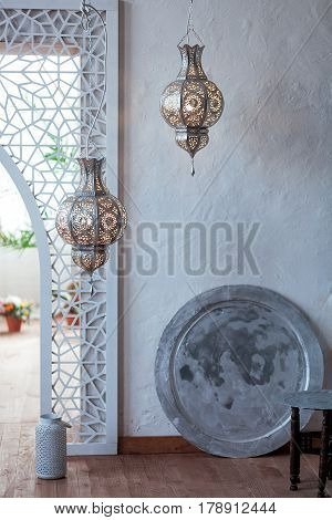 Selective focus point on Morocco light lantern decoration in living room interior - Vintage Light Filter.