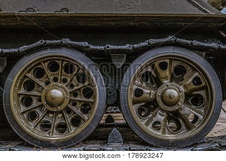 Tracked chassis Soviet self-propelled during the second world war. Tracked chassis with wheels closeup. Artillery WWII.