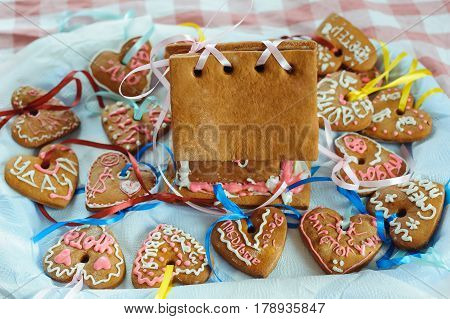 Homemade gingerbread house and decorated gingerbread hearts for wedding and Valentine's day.