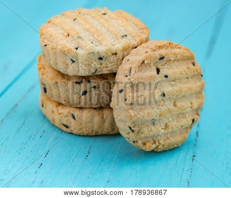 biscuit with seasame on a blue wood background