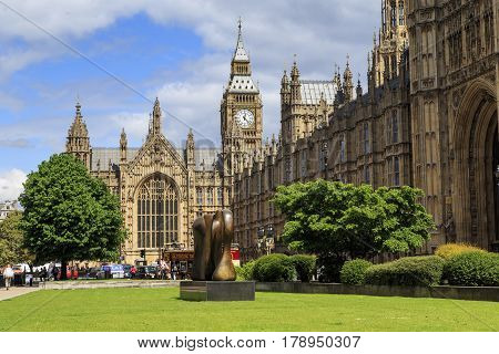 LONDON, GREAT BRITAIN - MAY 12, 2014: This is the building of the Westminster Palace on the side of Abindon Street Gadens.