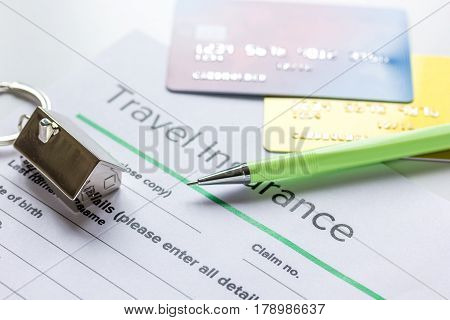 booking travel concept with insurance form and credit cards on white table background