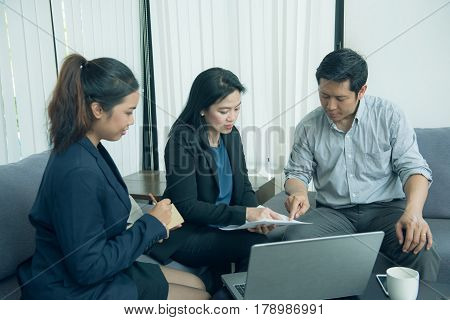 Pretty business interns listening to their team leader.
