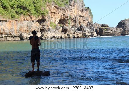 A Man Fishing In The Sea (fisherman)