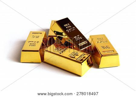 Isolated Shot Of Five Stacked 999 Fine Gold Ingot Bullion Bars.