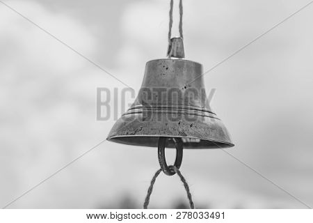 The Bell Hangs On A Rope Against The Sky