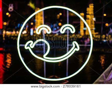 Neon Light  Of Humen Face Smile With Blur Background