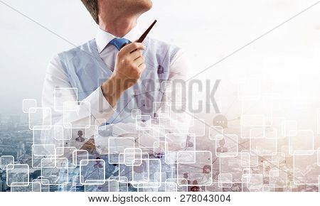 Double Exposure Of Confident And Young Businessman In Smart-casual Wear Smoking Pipe And Modern City