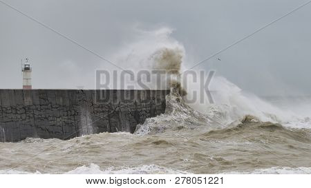 Stunning Waves Crashing Over Harbor Wall During Windy Storm At Newhaven On English Coast