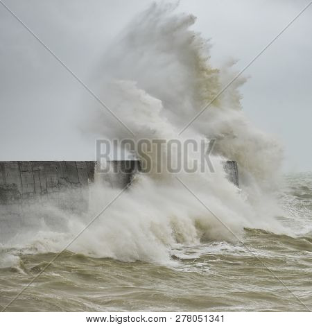 Stunning Waves Crashing Over Harbor Wall During Windy Storm At Newhaven On English Coast