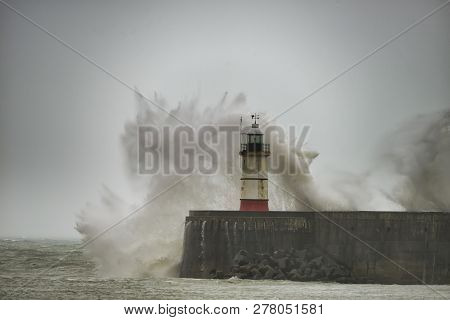 Stunning Waves Crashing Over Harbor Wall During Windy Storm At Newhaven On English Coast