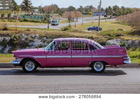 Havana, Cuba - Aug. 2017: Classic Vintage / Retro Car (pink Plymouth Fury 1959) From Side Proection,