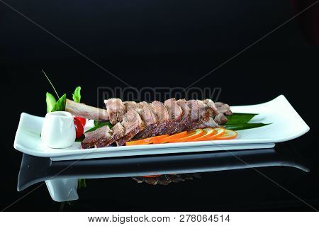 Sauce Char Siew Slices In A White Dish