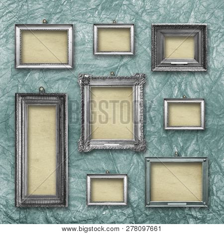 Set Of Wooden Vintage Silver  Modern,  Frames For Museum Exhibition On Old, Worn Green Wall