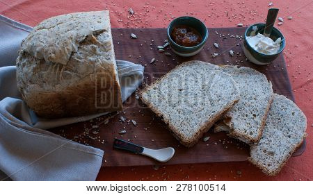 A Tasty And Healthy Breakfast In A Wooden Table Over A Brown Background