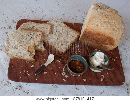 A Tasty And Healthy Breakfast In A Wooden Table Over A White Background