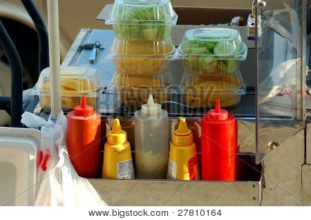 Fresh fruit and condiments on a street vendors cart in the Los Angeles Fashion District
