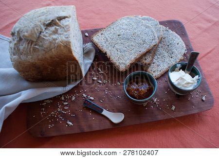 A Tasty And Healthy Breakfast In A Wooden Table Over A Brown Background