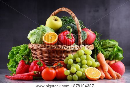 Fresh Organic Fruits And Vegetables In Wicker Basket