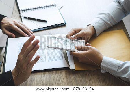Anti Bribery And Corruption Concept, Business Man Refusing And Don't Receive Money Banknote Offered 