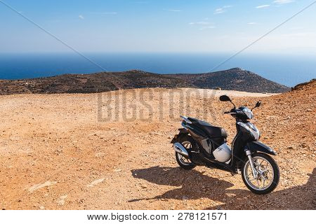 Sifnos, Greece - September12, 2018: Scooter Parked On The Top Of The Mountain. Sifnos Island, Cyclad