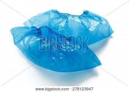 Two Blue Medical Shoe Covers For Feet Isolated On White Background. Hygiene And Cleanliness In Healt
