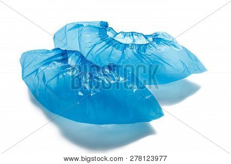 Two Blue Medical Shoe Covers For Feet Isolated On White Background. Hygiene And Cleanliness In Healt