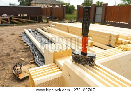 Construction Of The House From A Bar. Drilling Holes And Clogging Of Dowels.