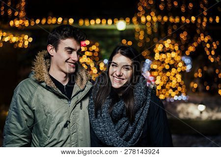 Night Portrait Of A Happy Couple  Smiling Enjoying Winter And Snow Aoutdoors.winter Joy.positive Emo