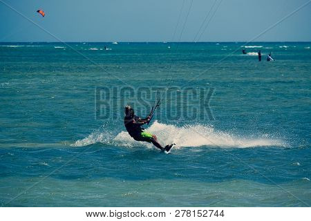 Mui Ne, Vietnam - 11 2018: Kitesurfing, Kiteboarding, Kite Surf. Extreme Sport Kitesurfing In Tropic